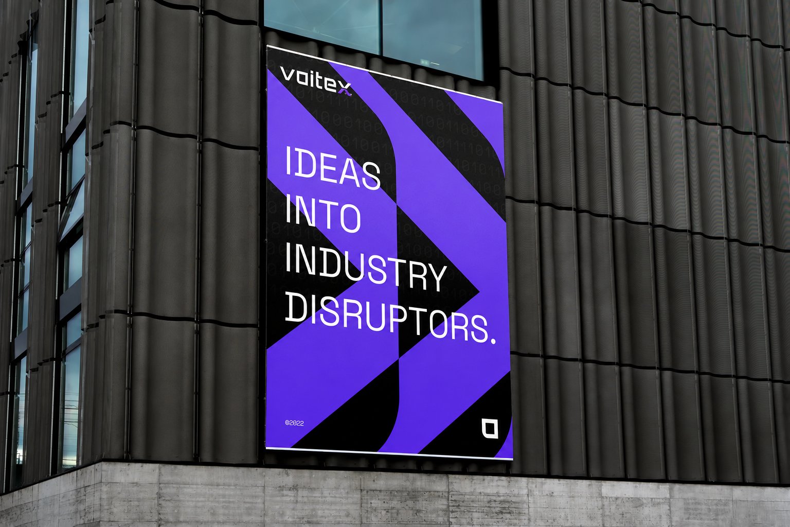 Voitex launch advertising on a building billboard — 'Ideas into industry disruptors.'